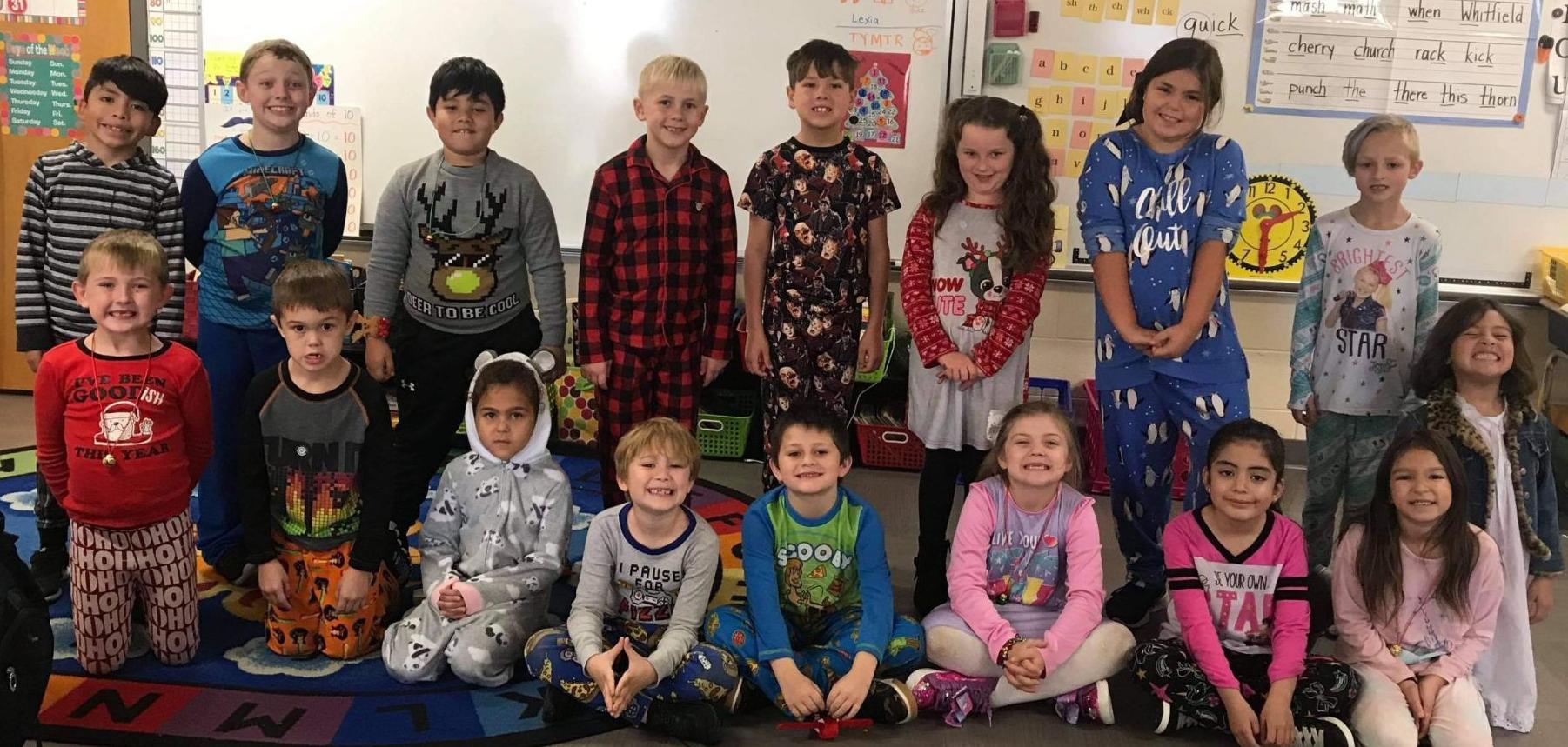 FIRST GRADERS CELEBRATING CHRISTMAS